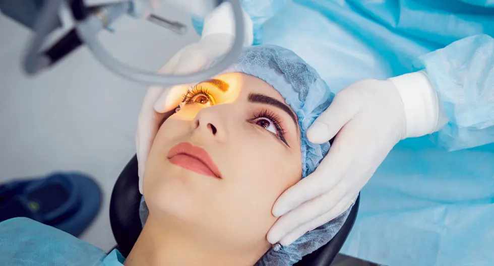 Why Do I See Floaters in My Eyes? Causes, Symptoms and Treatment Ophthalmologist examining a patient's retina to investigate eye floaters.